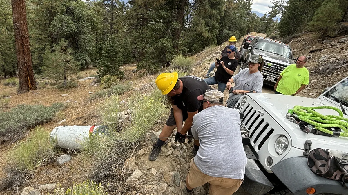Volunteers performing trail maintenance